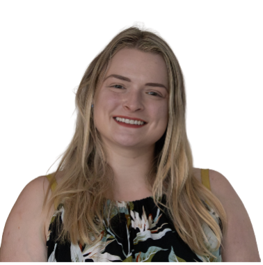 Rebecca has long blonde hair and is wearing a black patterned top. She is smiling at us.